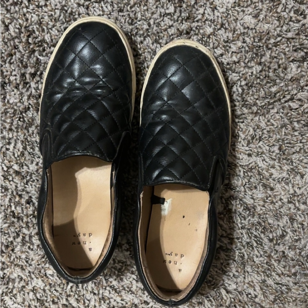Woman’s Black Quilted Slip-On Shoes